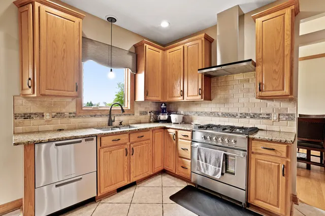a living room with furniture fireplace and window