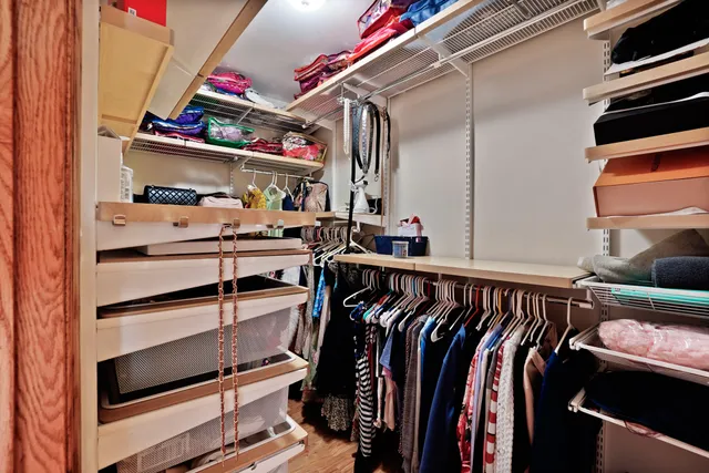 a bedroom with a bed and a mirror