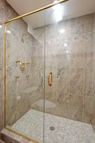 an aerial view of a house with a garden and lake view