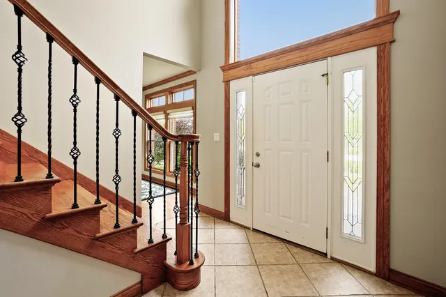 a bathroom with a toilet a sink and a mirror
