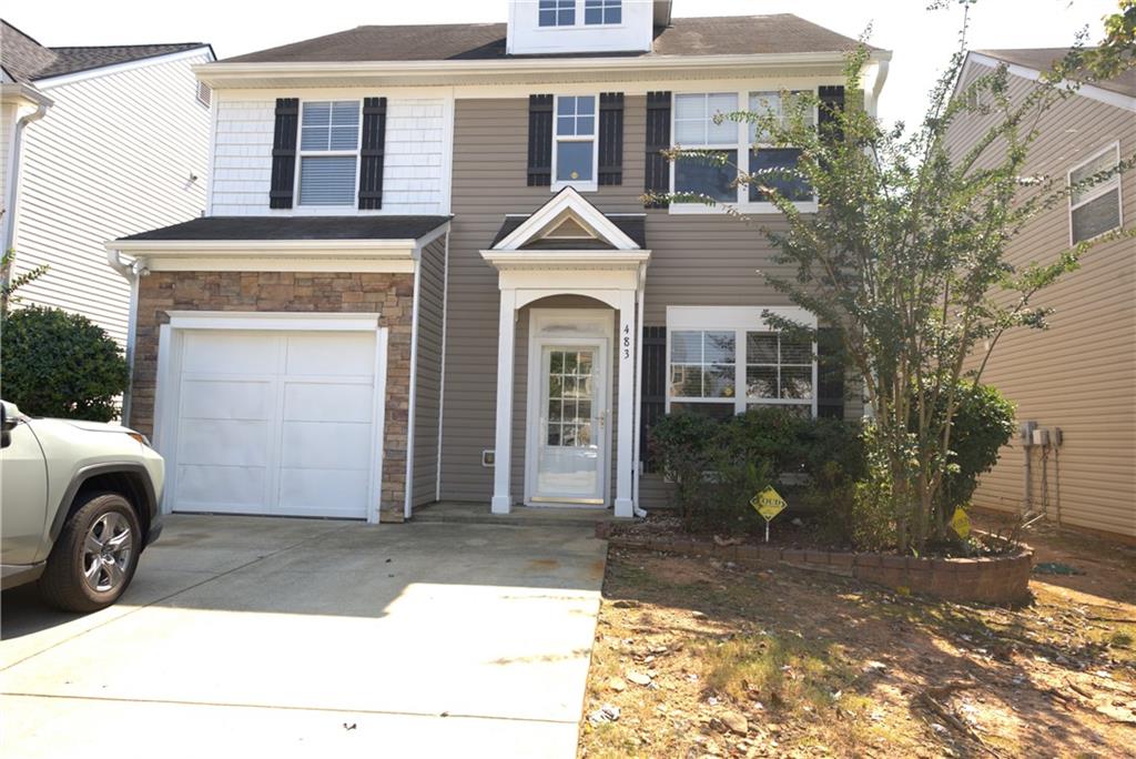 a front view of a house with a yard
