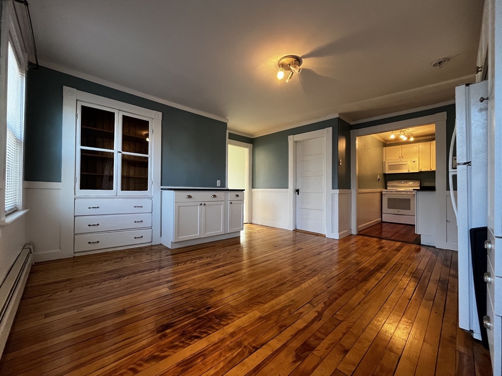 263 Middlesex Street, Unit 2 North Andover, MA 01845 - Photo 8 of 16 a view of empty room with wooden floor and windows