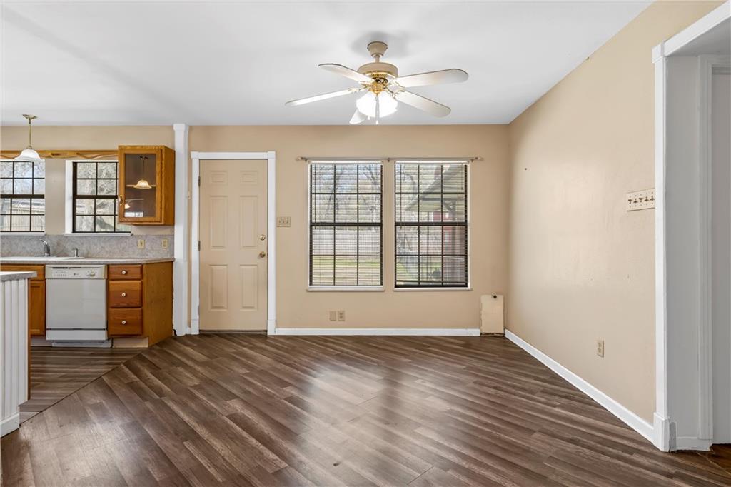 271 Candyce Drive Lorena, TX 76655 - Photo 8 of 27 an empty room with wooden floor chandelier and windows