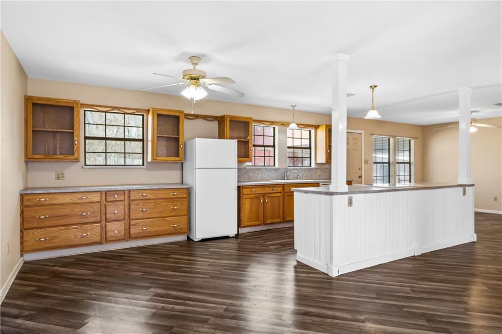 271 Candyce Drive Lorena, TX 76655 - Photo 10 of 27 a living room with wooden floors and kitchen view