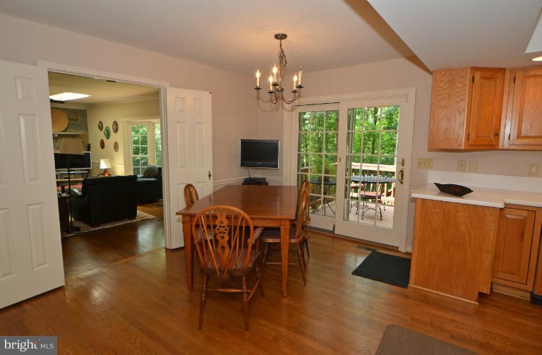 2010 Roundhouse Road Vienna, VA 22181 - Photo 10 of 30 a view of a dining room with furniture window and wooden floor