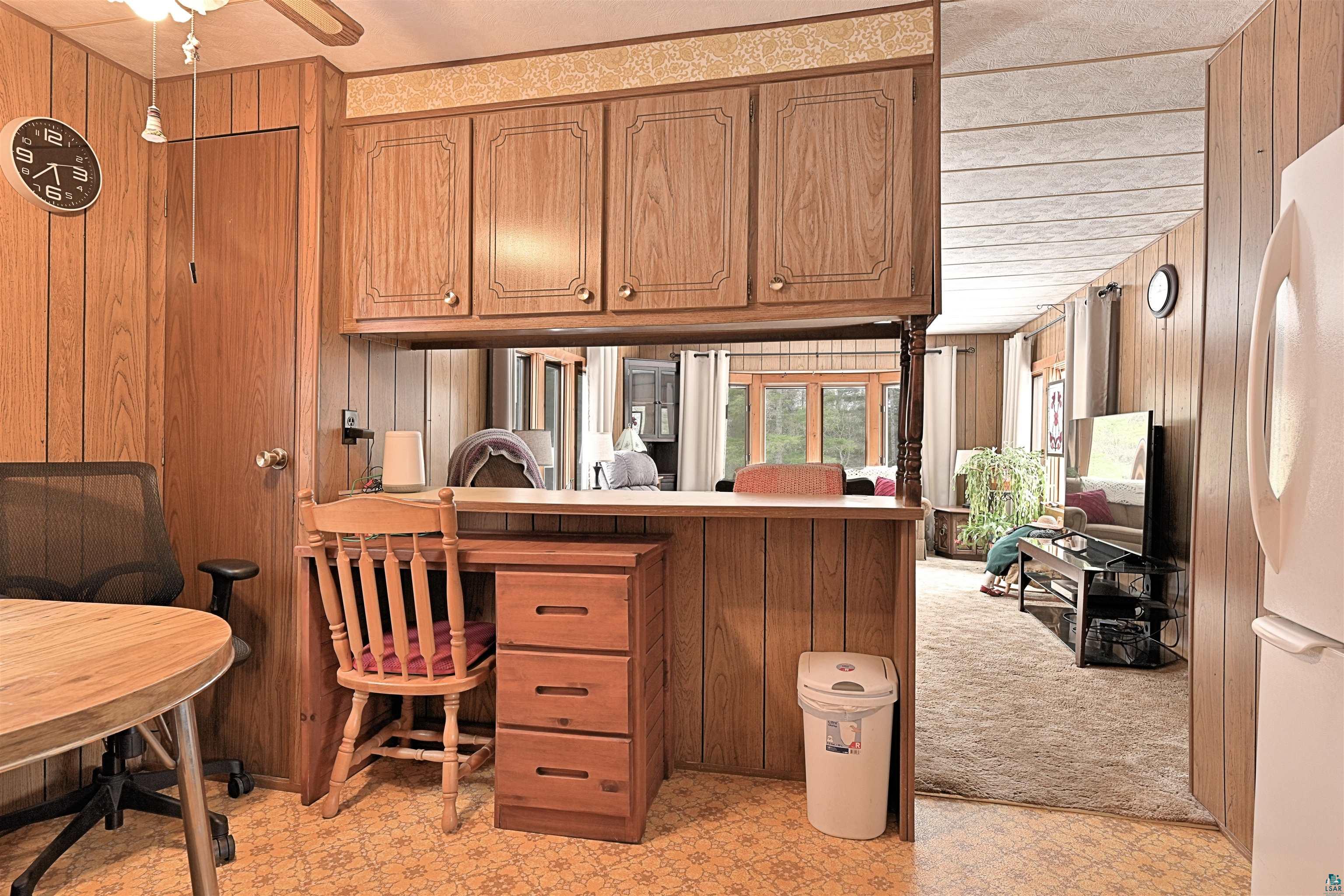 6800 Salveson Road Finland, MN 55603 - Photo 12 of 20 Office space featuring light floors, wood walls, and a ceiling fan