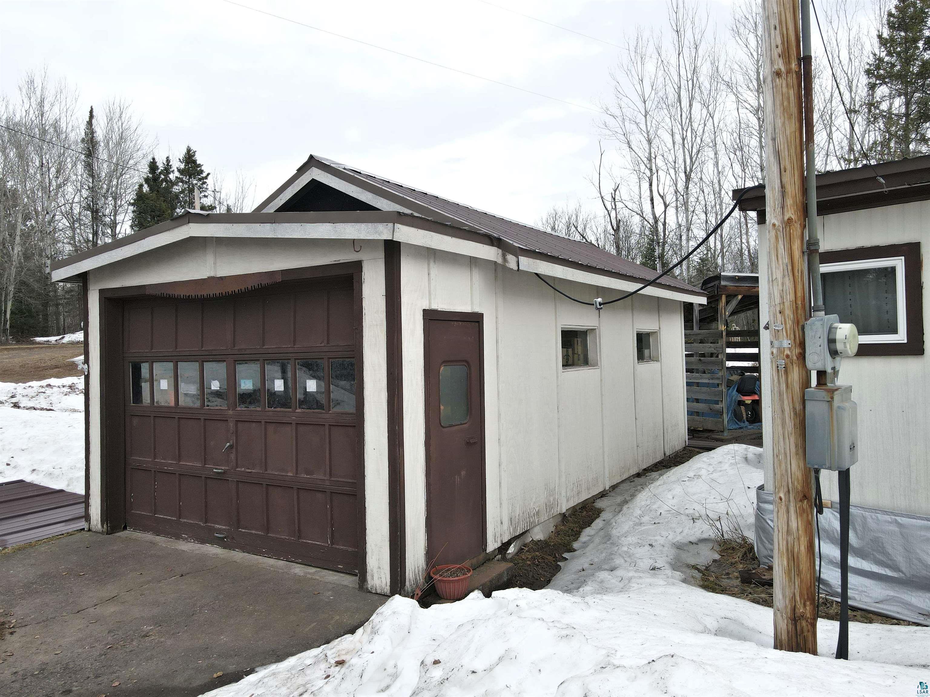 6800 Salveson Road Finland, MN 55603 - Photo 8 of 20 Snow covered garage with a garage