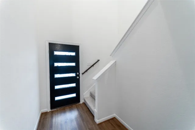 a view of entryway with wooden floor