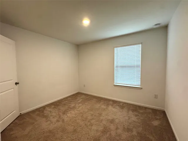 an empty room with a natural light