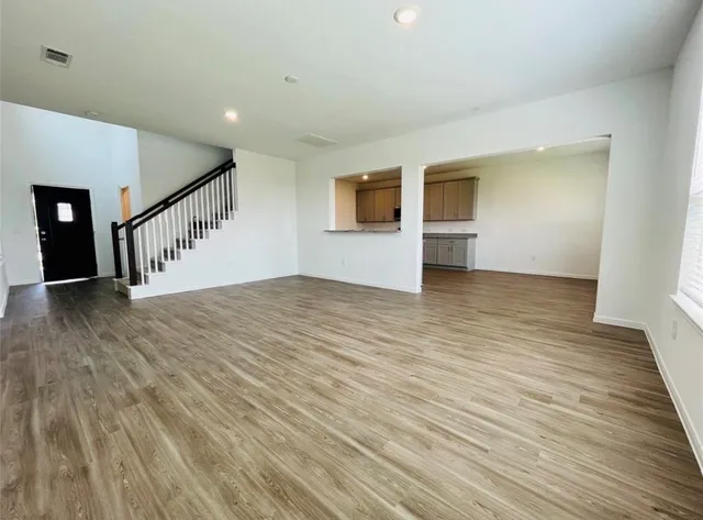 a view of an entryway with wooden floor