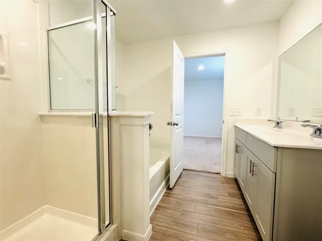 a bathroom with a double vanity sink and a mirror