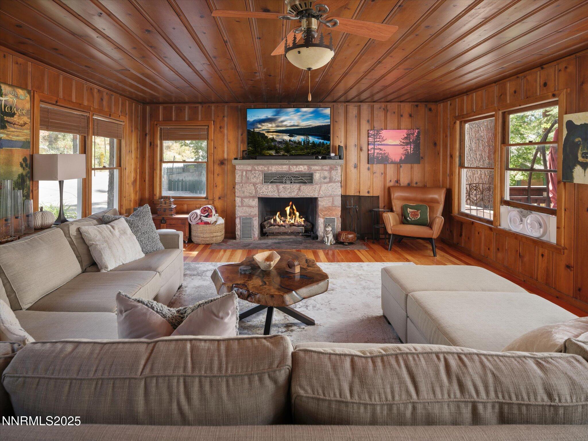 644 Job Lane Zephyr Cove, NV 89448 - Photo 6 of 26 a living room with furniture a fireplace and a flat screen tv