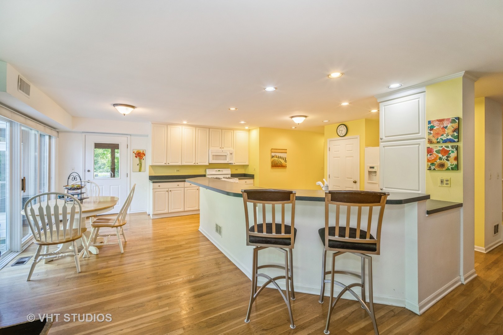 60 Birchwood Road Northbrook, IL 60062 - Photo 8 of 32 a view of a dining room kitchen with furniture and wooden floor