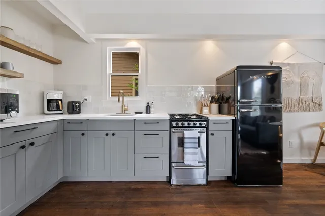 a living room with a couch and a rug
