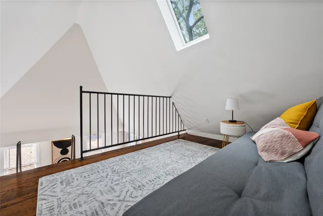 a bathroom with a sink a mirror a vanity and a shower