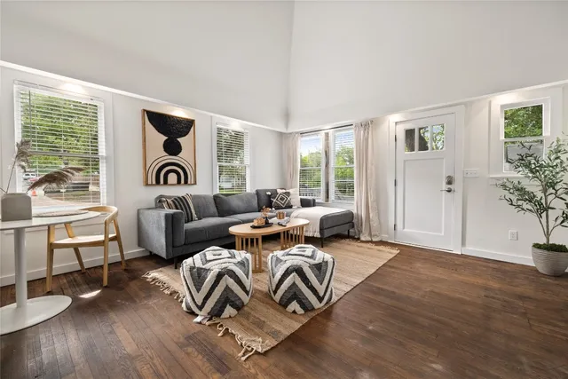 a living room with furniture or window and a wooden floor