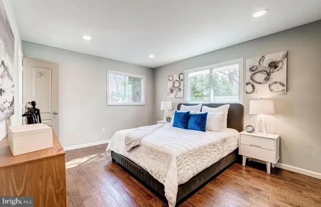 a bedroom with a bed and a dresser