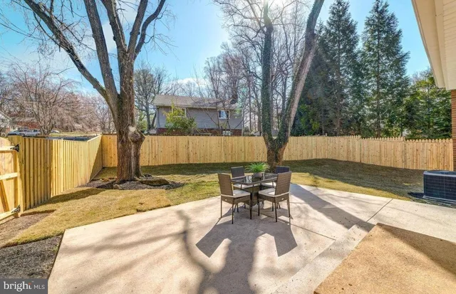 a view of a backyard with sitting area