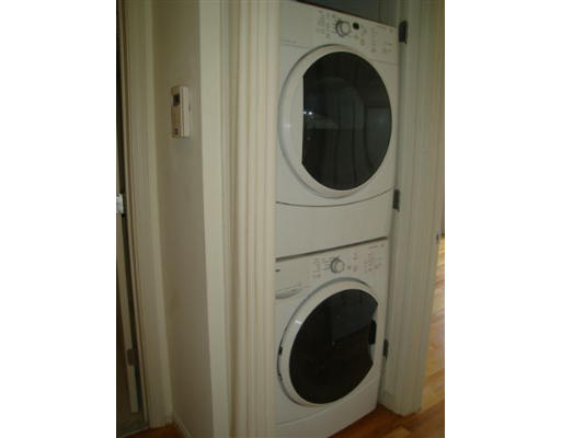 8 Chestnut Street, Unit 8 Cambridge, MA 02139 - Photo 9 of 11 a view of a hallway with washer and dryer