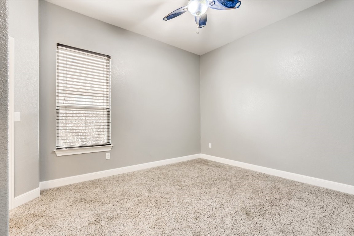 6108 Sabino Drive Spicewood, TX 78669 - Photo 15 of 22 an empty room with a window and a fan