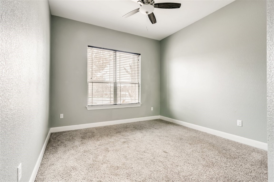 6108 Sabino Drive Spicewood, TX 78669 - Photo 18 of 22 an empty room with a window