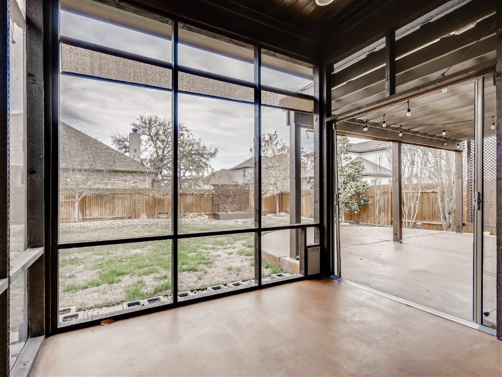 6108 Sabino Drive Spicewood, TX 78669 - Photo 20 of 22 a view of an empty room with a large window
