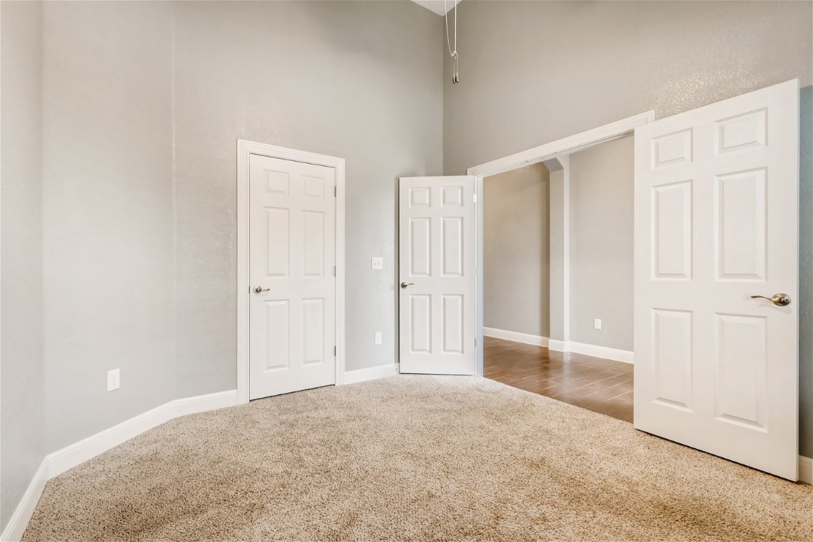 6108 Sabino Drive Spicewood, TX 78669 - Photo 9 of 22 an empty room with windows