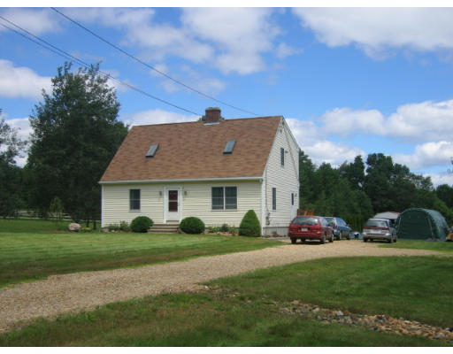 a view of a house with a garden