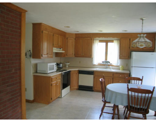 8 Brooks Pond Road North Brookfield, MA 01535 - Photo 4 of 8 a kitchen with stainless steel appliances granite countertop a stove a sink dishwasher and cabinets