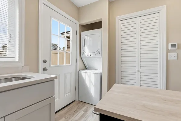 a room with a window and washer