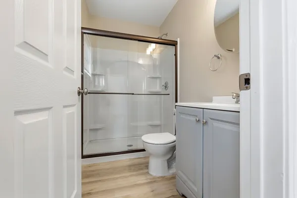 a bathroom with a sink toilet and shower