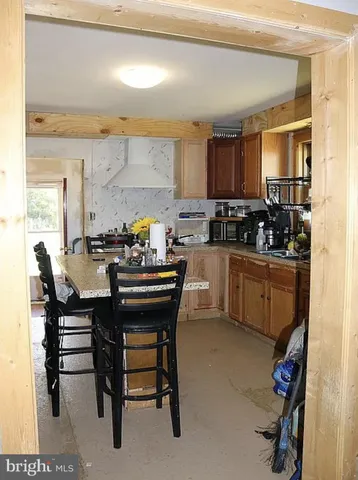 a kitchen with a sink appliances and cabinets