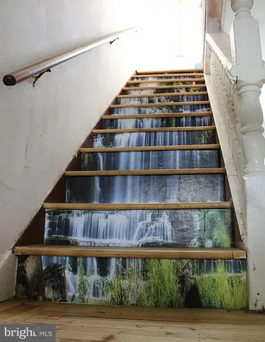 a view of staircase with large windows