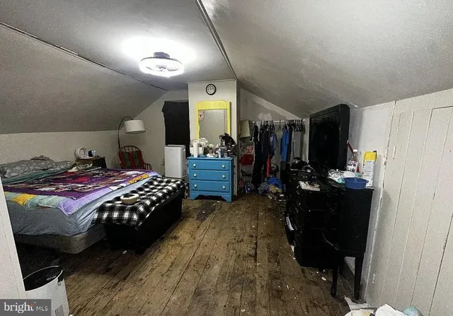 a bedroom with a bed and a walk in closet