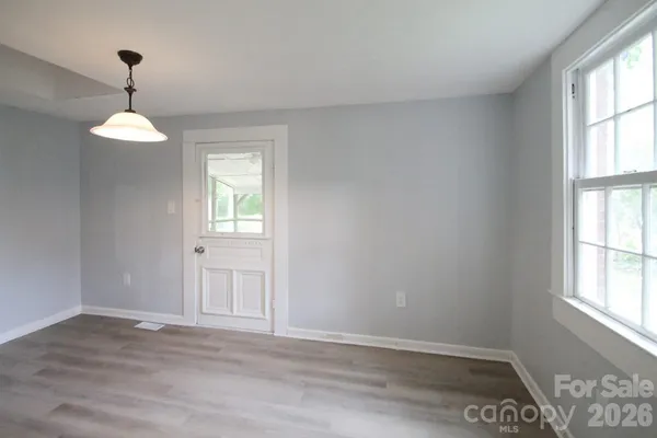 a view of an empty room with a window