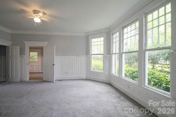 a view of empty room with a fireplace