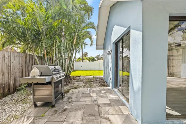 a view of swimming pool with sitting area