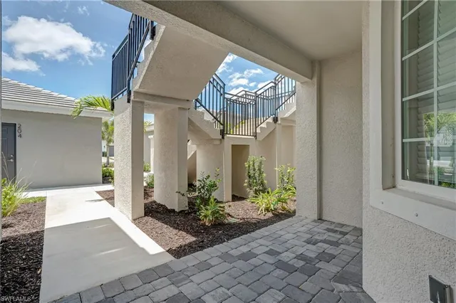 a lobby with furniture and a chandelier