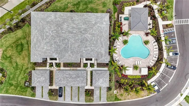 an aerial view of a house with a swimming pool