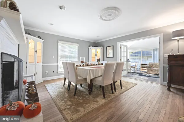 a view of a dining room with furniture and a flat screen tv