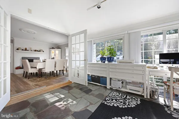 a living room with furniture a window and a fireplace