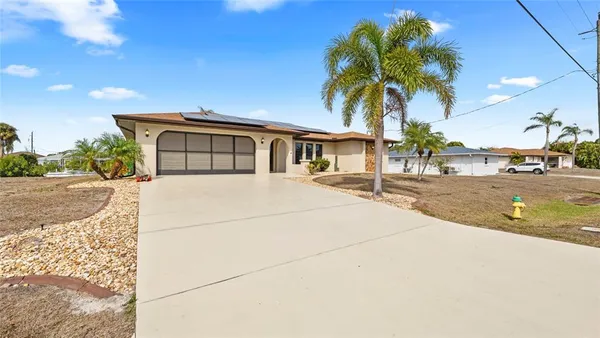 a house with palm tree in front of it