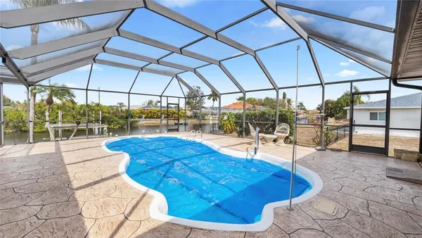 a view of a swimming pool with a lounge chairs