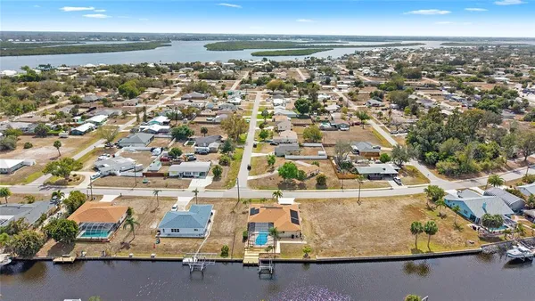 an aerial view of residential building and ocean
