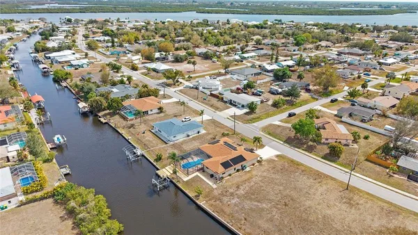 an aerial view of a house with a lake view
