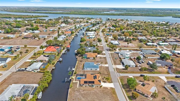 an aerial view of a house with outdoor space