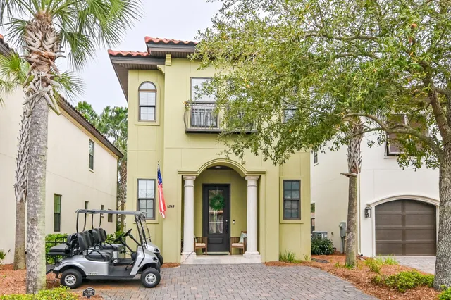 a bathroom with a granite countertop double vanity sink and a mirror