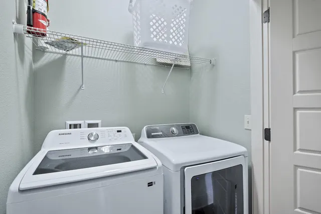 a view of a house with a tree in the background