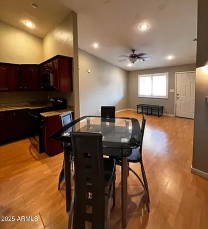 a kitchen with a table and chairs in it