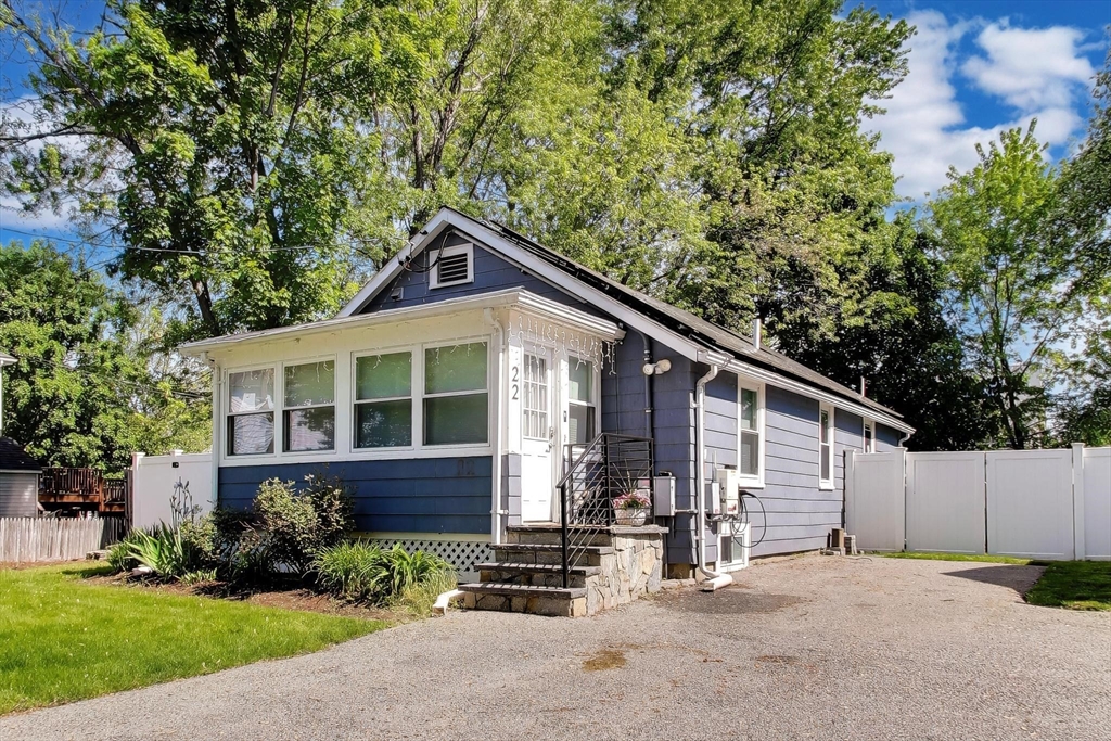 22 Douglas Road Ashland, MA 01721 - Photo 2 of 24 a front view of a house with a yard